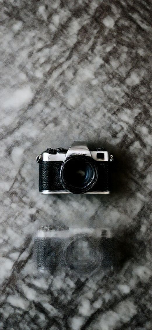 Film Camera On Marble Flatlay Photorealistic Wallpaper